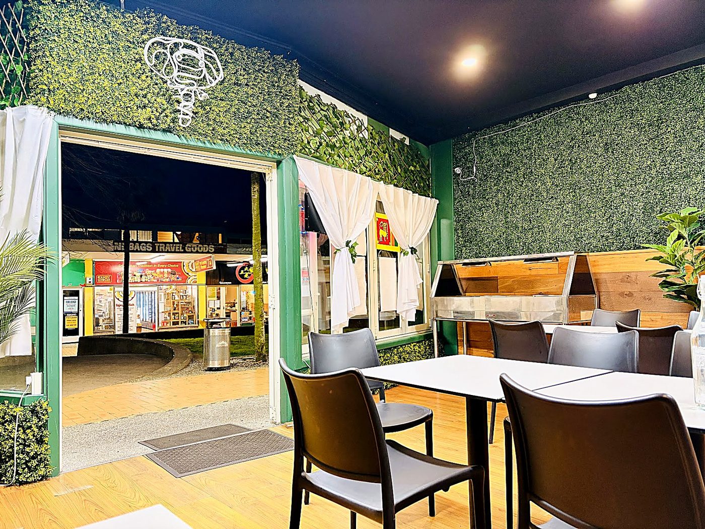 Botanical dining room interior with ivy walls